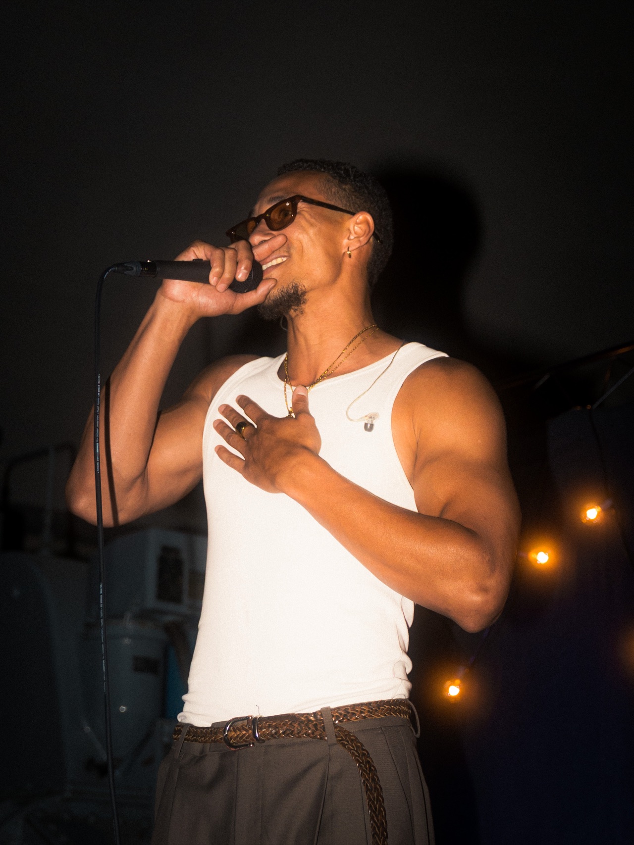 SELAH live on stage with a hand on his heart