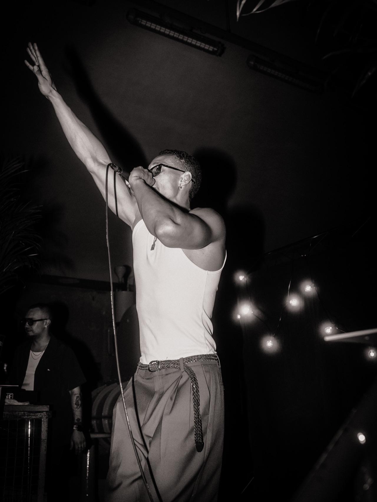 SELAH performing with an arm raised, black and white